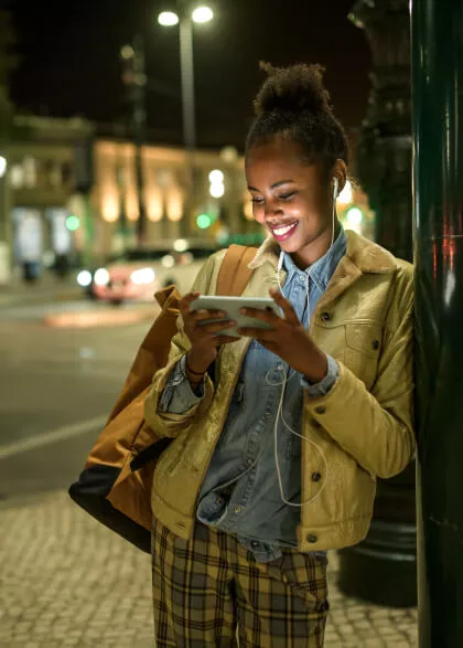 Woman enjoying a TV show on the go from her phone