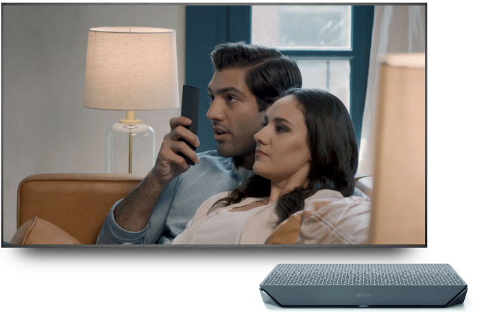 Man speaking into Xfinity X1 voice remote