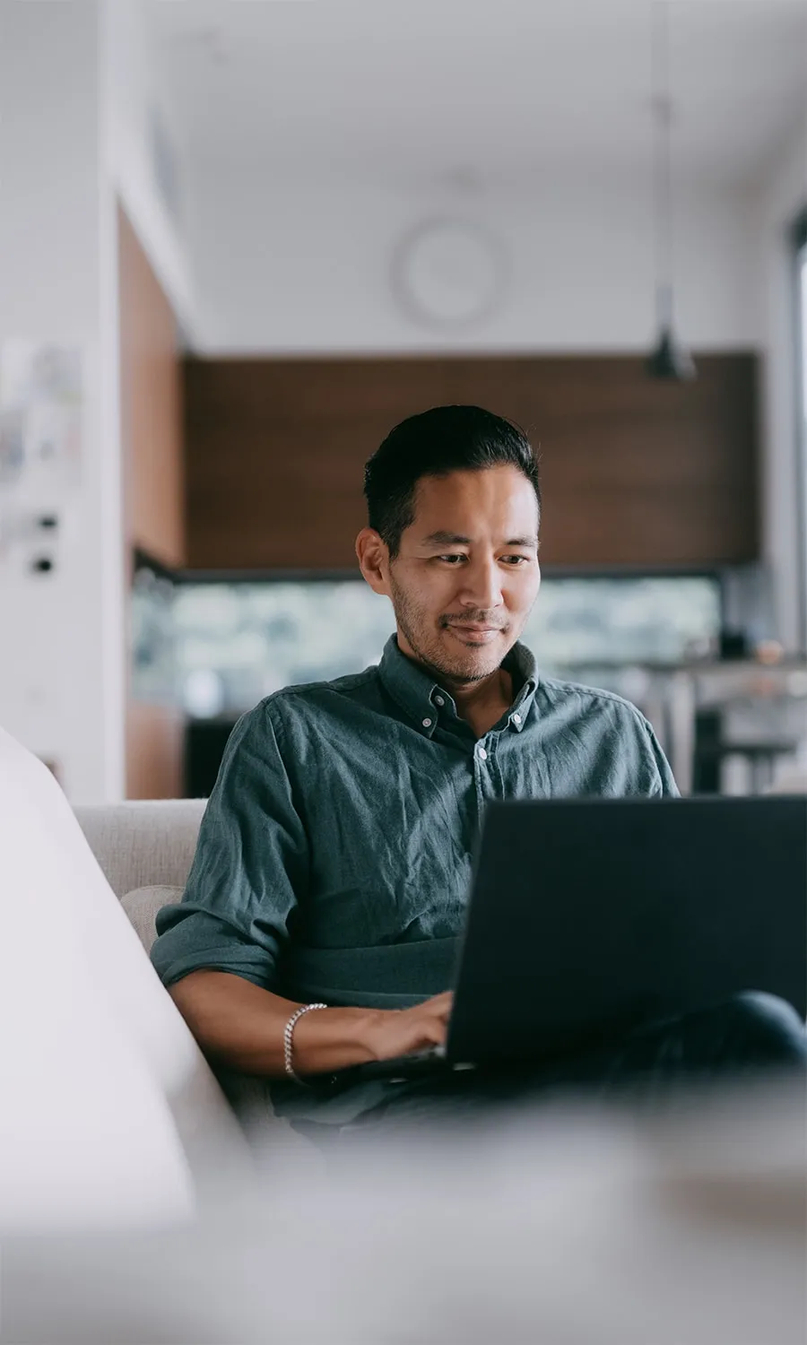 man watching TV on his laptop