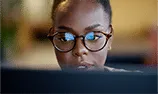 Woman looking at laptop